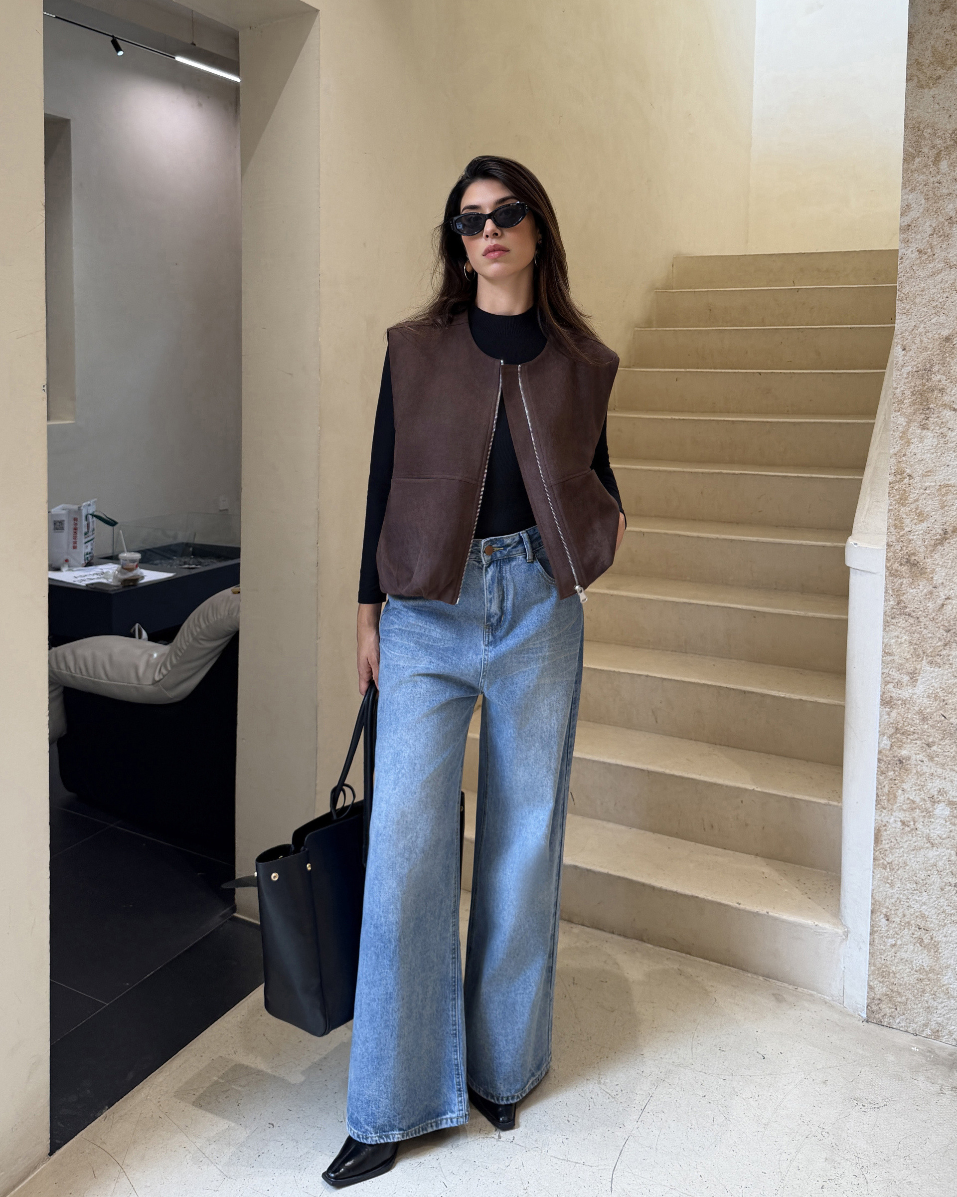 Sleeveless suede vest with front zipper and pockets