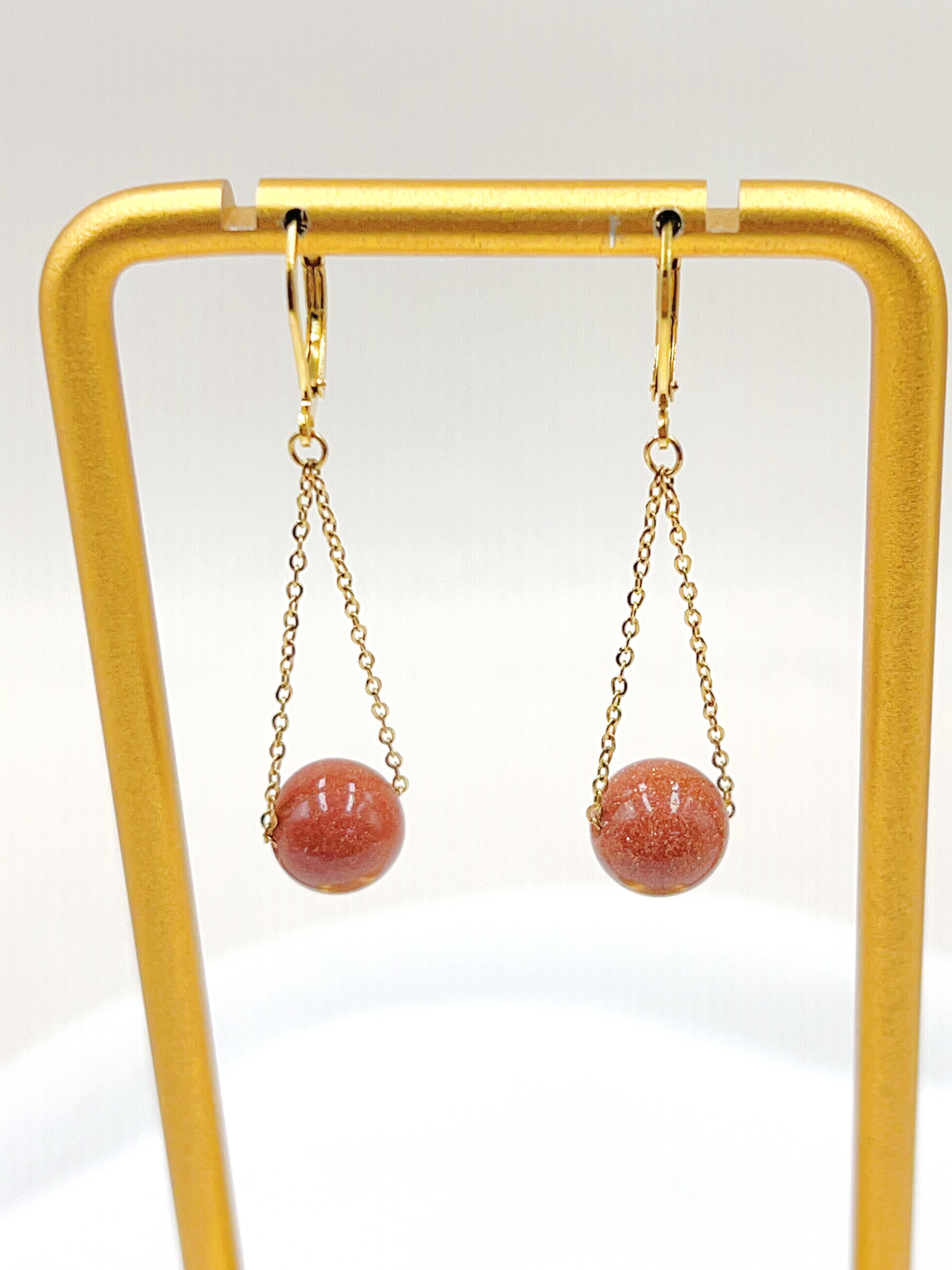 Grossiste WEC Bijoux - BOUCLE D' OREILLES EN ACIER INOXYDABLE + PIERRE DE SOLEIL