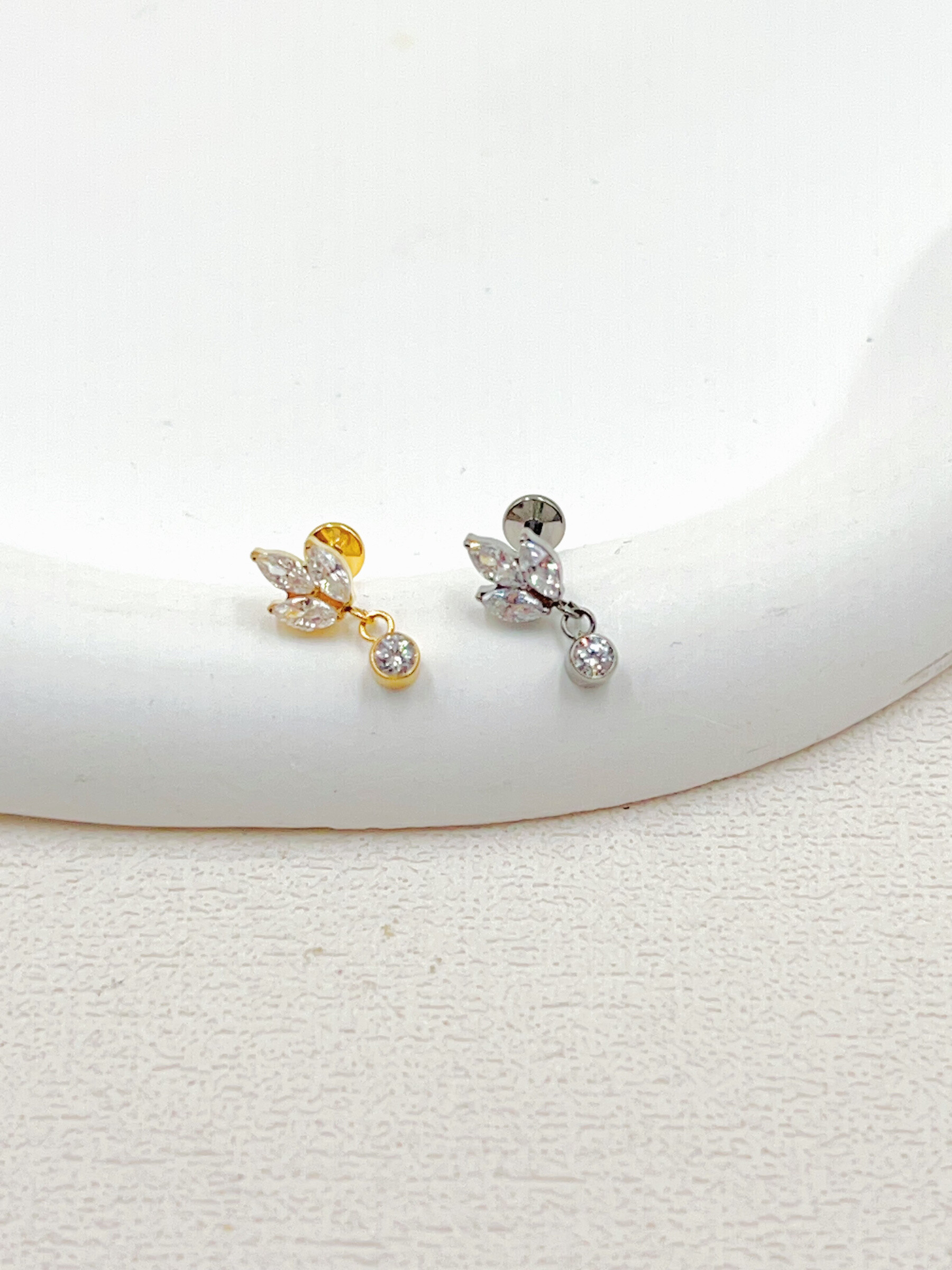 Grossista WEC Bijoux - Piercing in titanio, zirconio