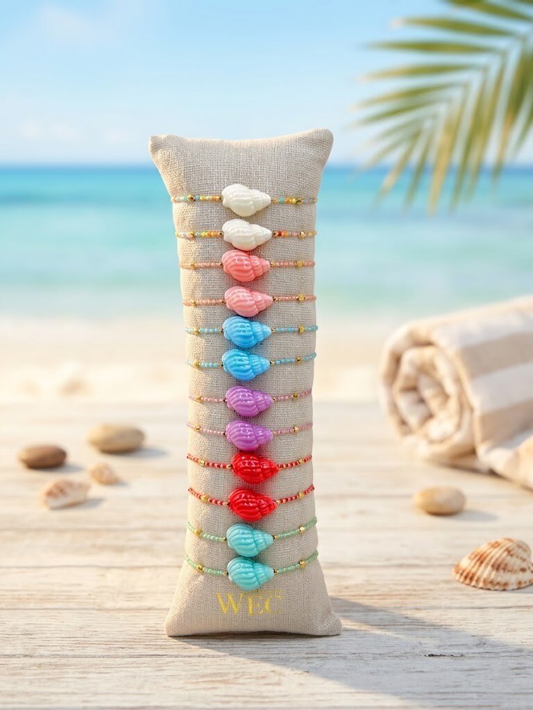 Grossista WEC - Set di 12 Braccialetti con Conchiglia in Acciaio Inossidabile +Cordoncino - Collezione «Bagliore Marino»