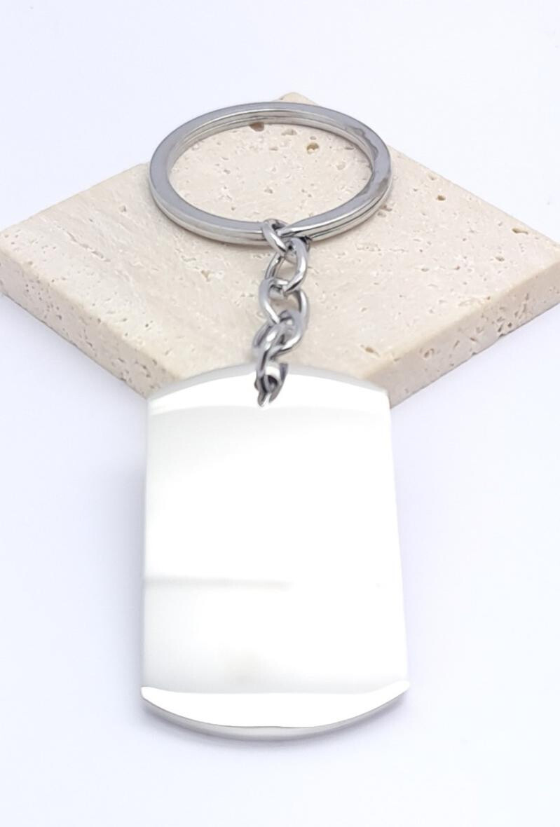 Grossiste Bijoussimo - Porte-clé à graver plaque acier rectangle courbé