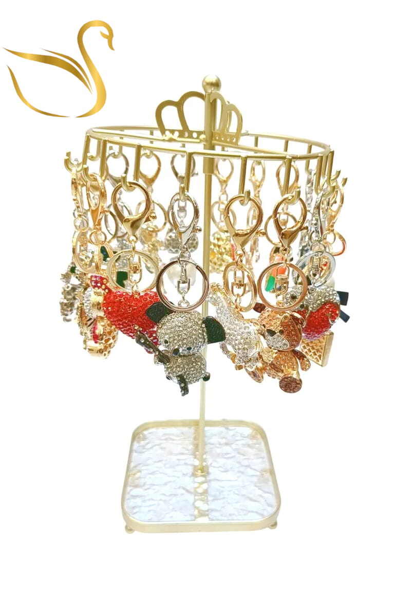 Mayorista Emma Fantaisies - Llavero carrusel con 18 charms para bolsos y soporte de exhibición