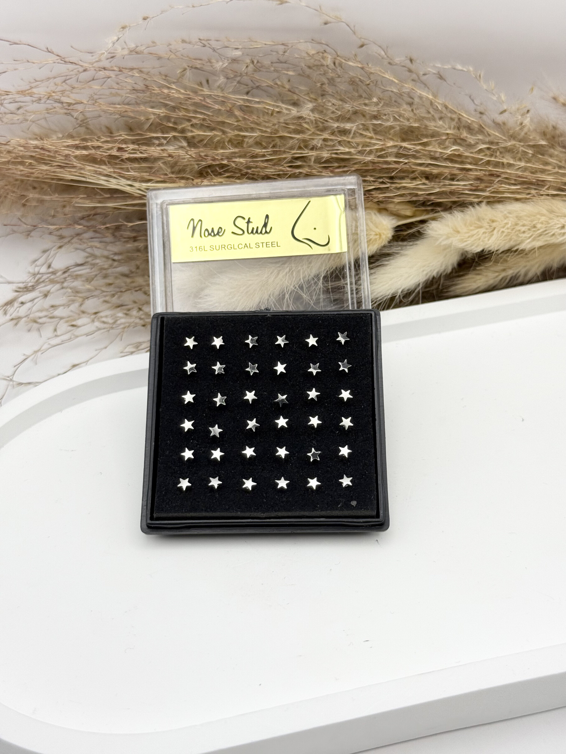 Grossiste Ceramik - Boîte de 36 Piercings de Nez petit boule Acier Inoxydable, Tige 9mm étoiles