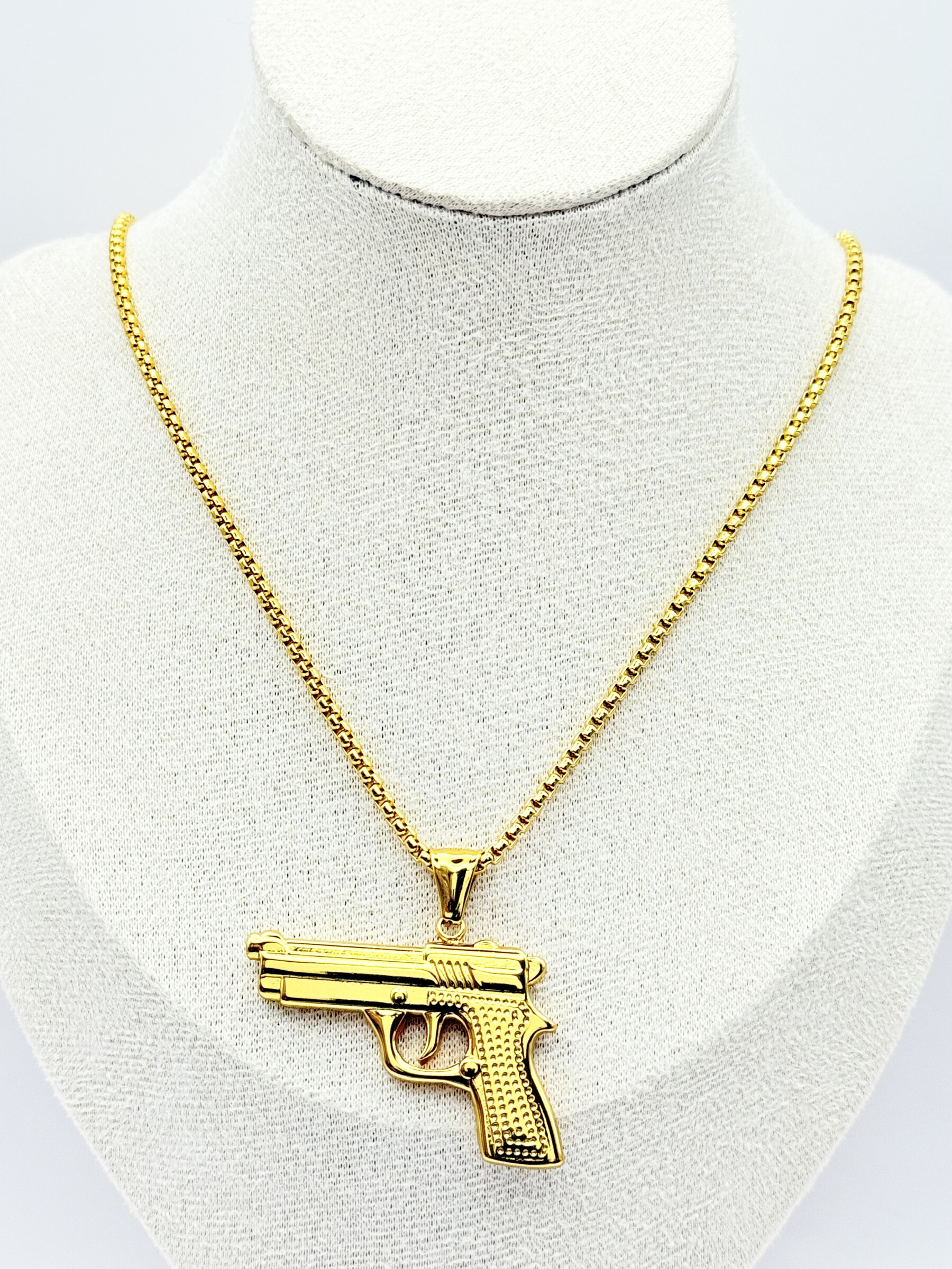 Wholesaler Ceramik - Necklace with modern gun pendant in gold stainless steel – Length 55 cm