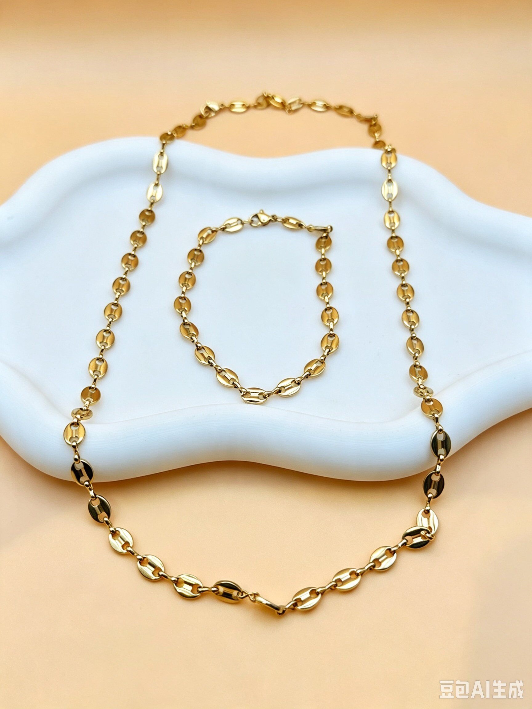 Grossista Ceramik - Set collana + bracciale con maglie a chicco di caffè in acciaio inox dorato 6mm