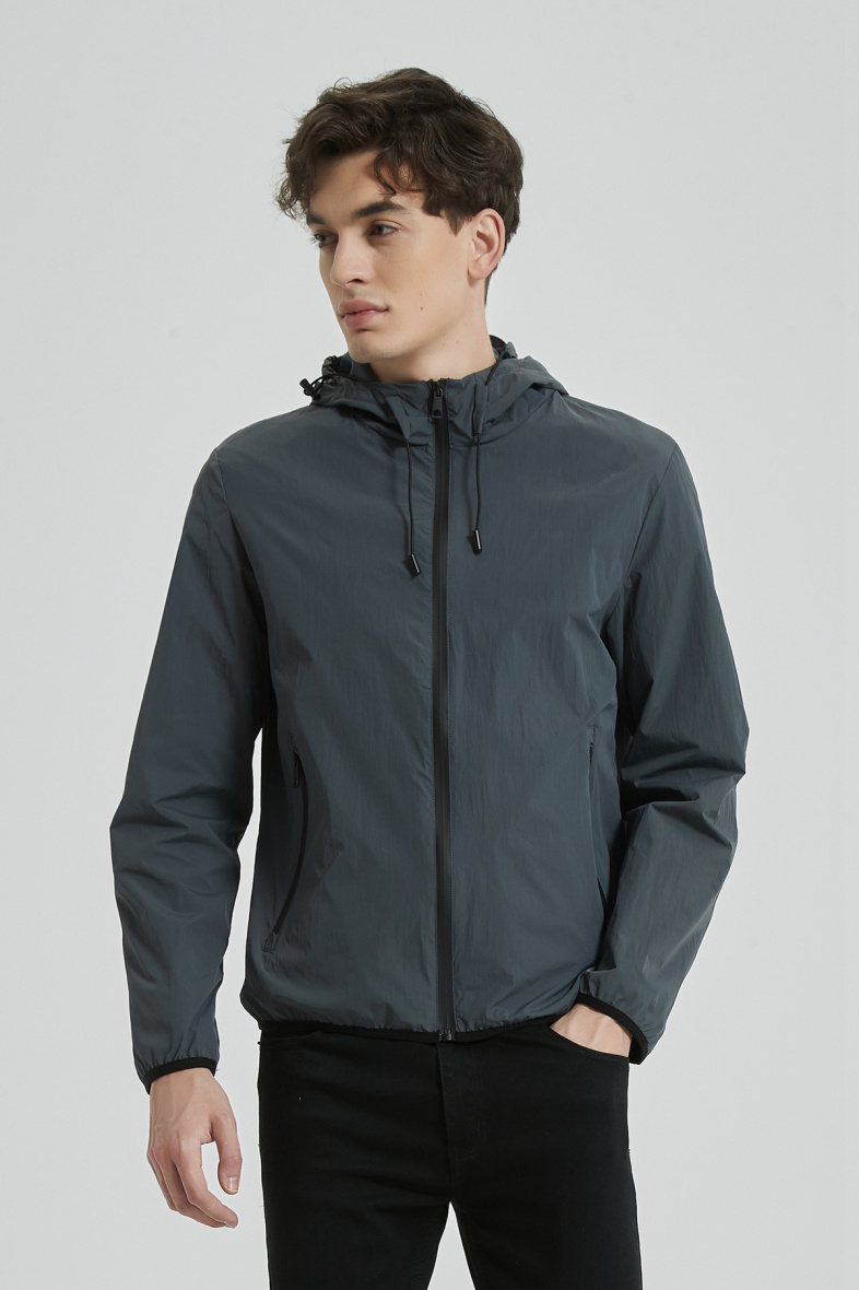 Wholesaler KYMAXX - Lightweight water-repellent plain jacket with integrated hood and multi-pockets